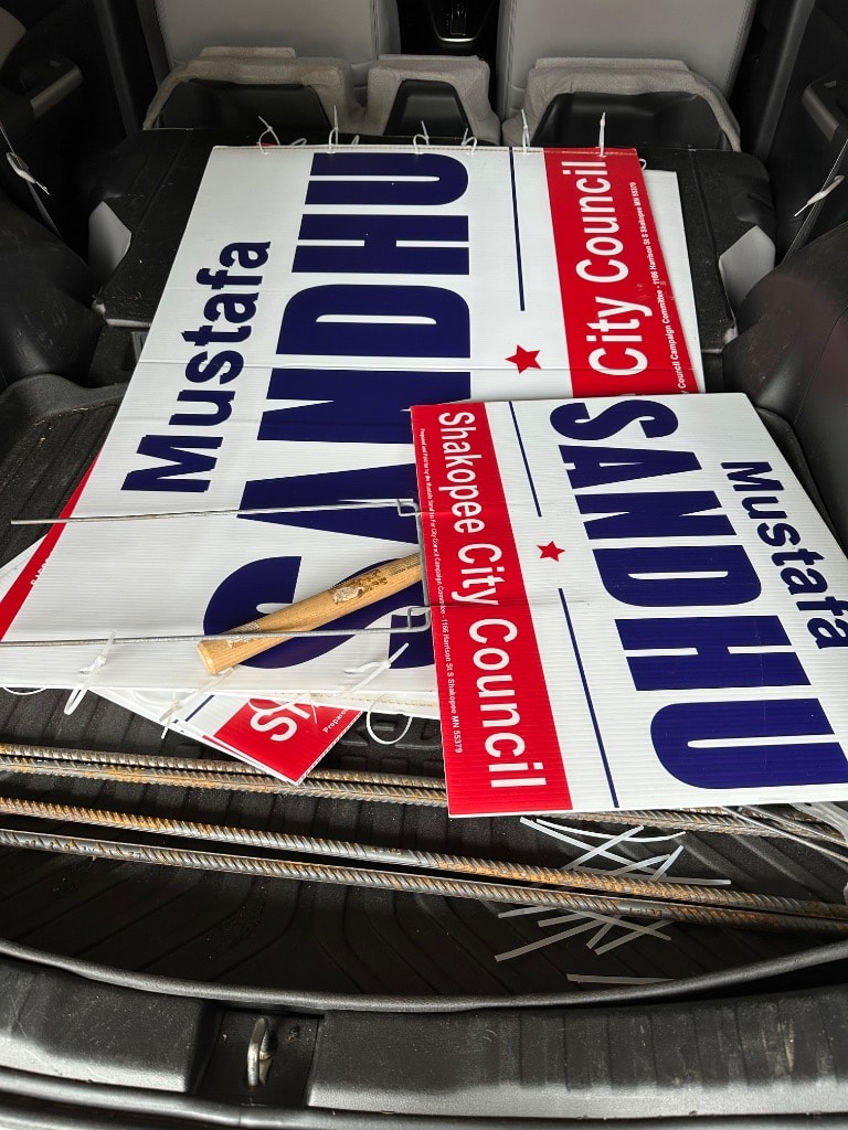 Political campaign signs stacked in a vehicle