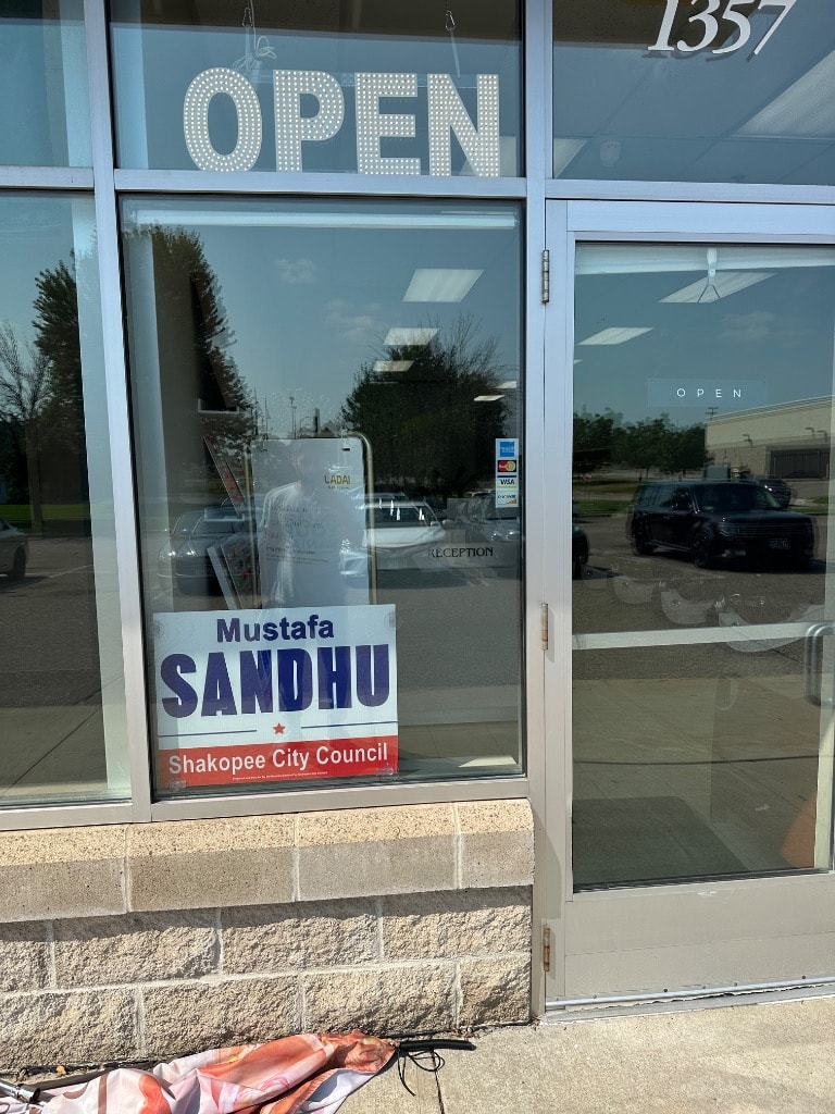 Storefront window with campaign poster