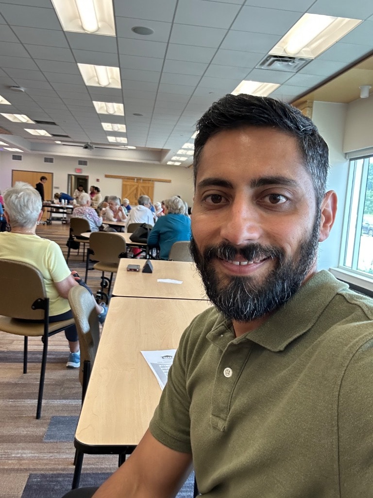 Man selfie at a community event indoors