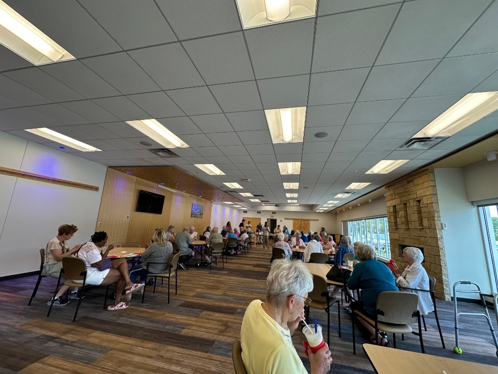 People gathered in a community center hall