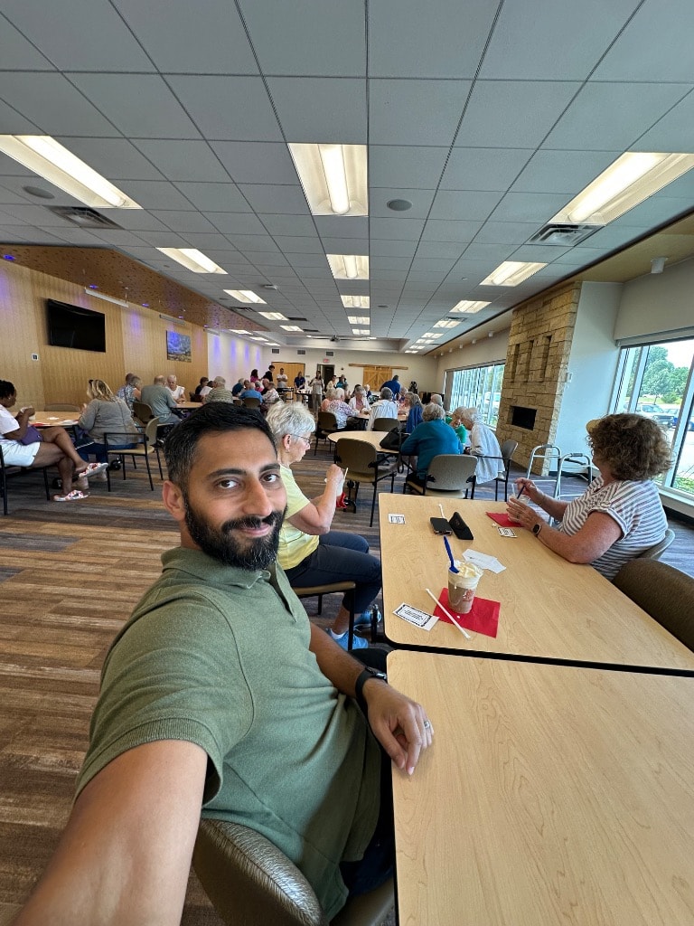 Man at a community gathering event indoors