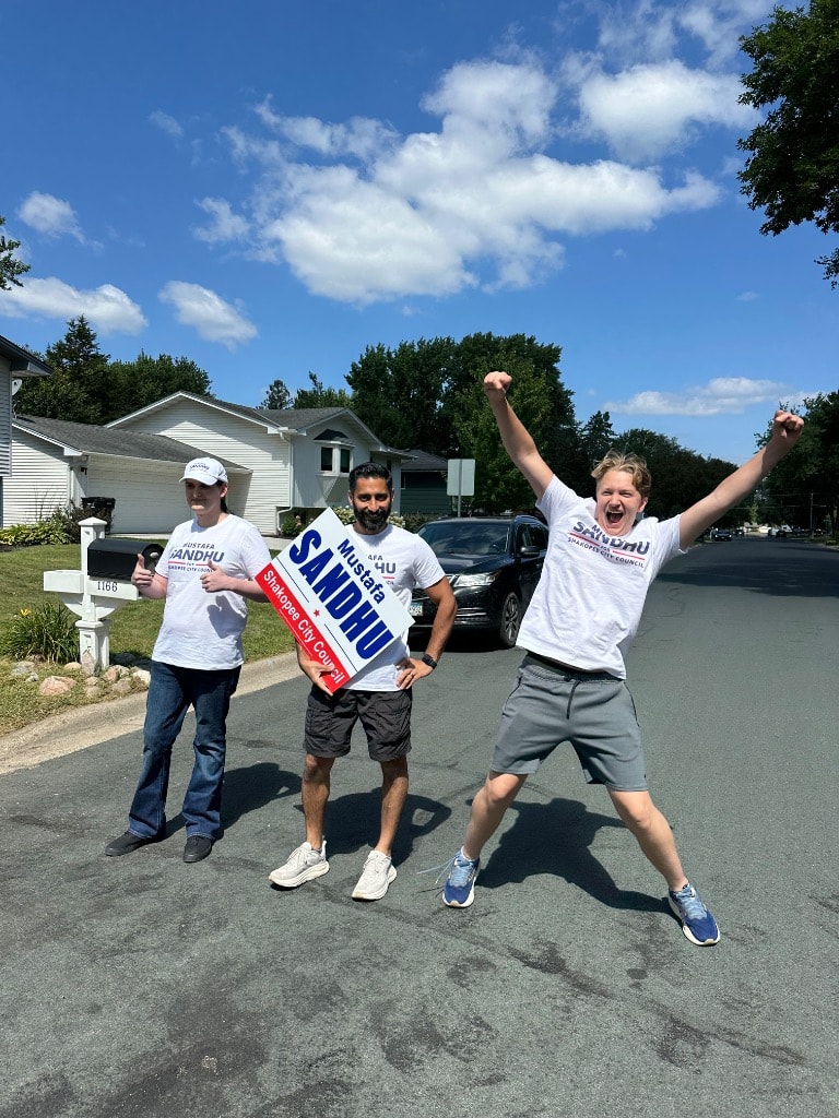Campaign volunteers celebrating on a residential street