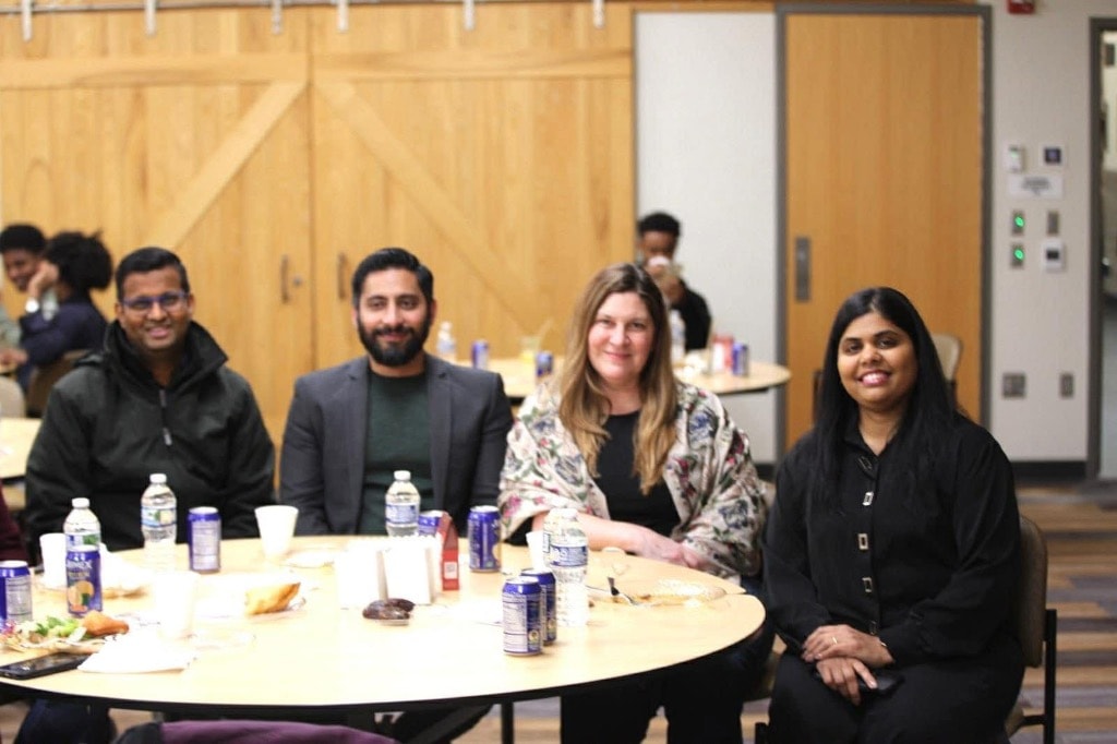 Diverse group seated at a conference table