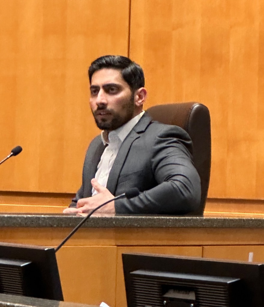 Mustafa Sandhu seated at the Shakopee City Council dais
