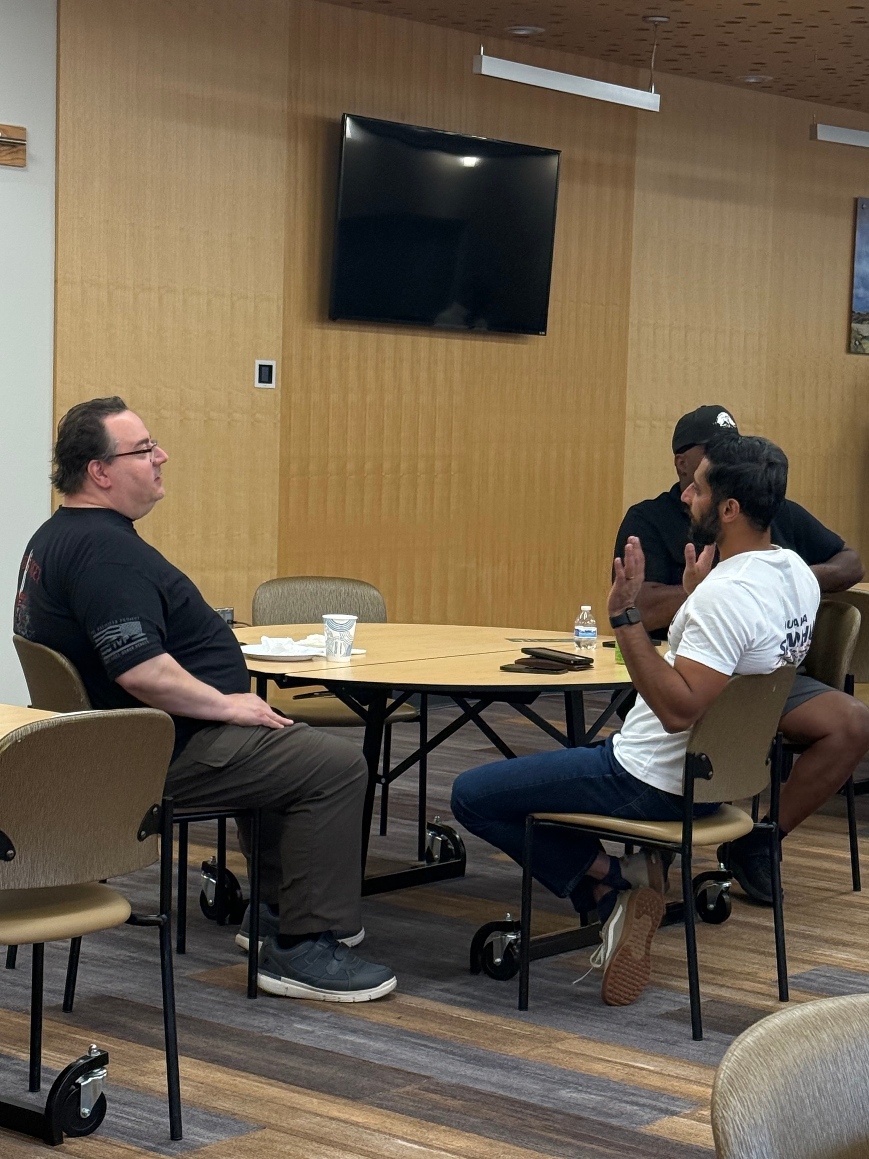 Four people meeting in a modern conference room
