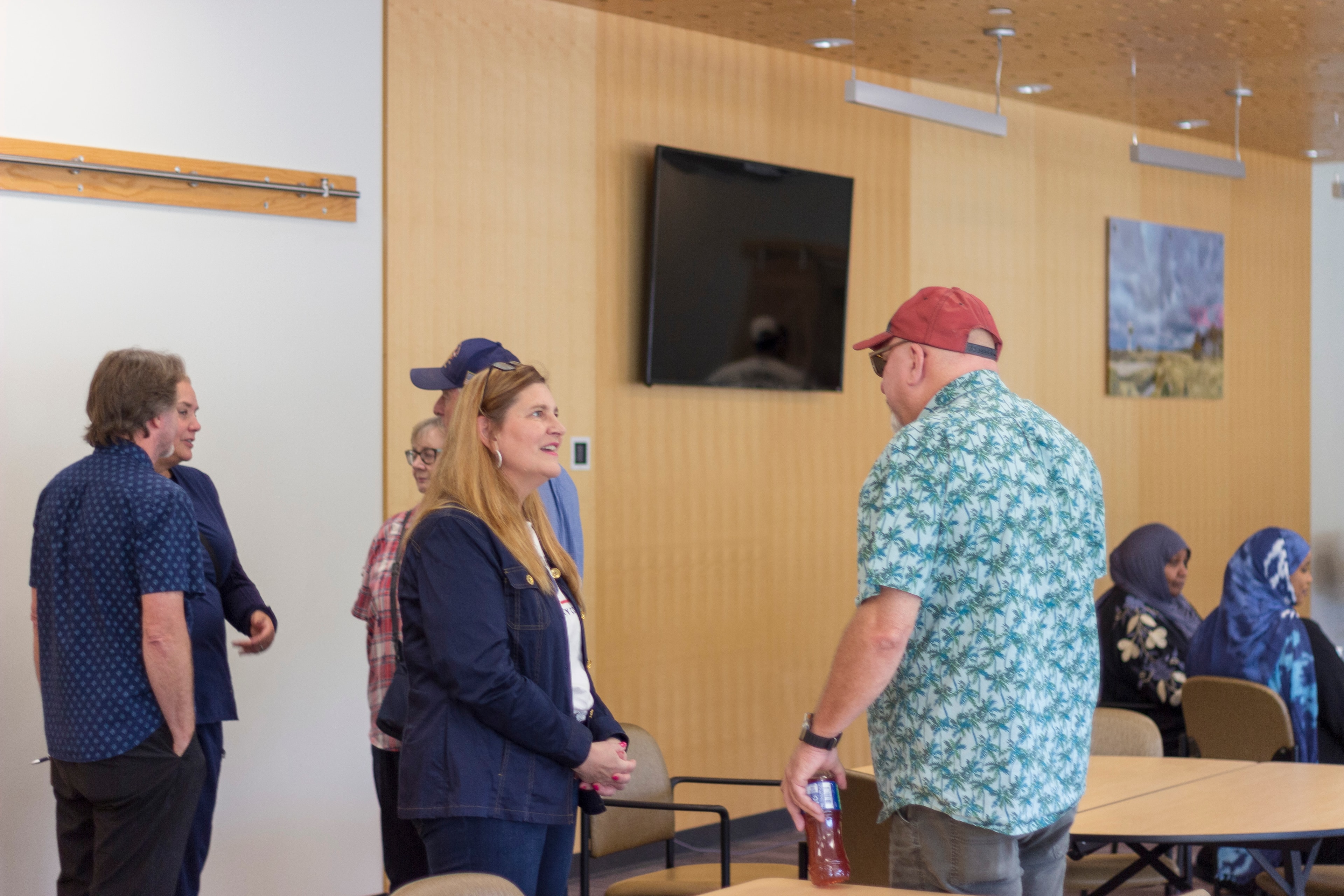 Supporters chatting and connecting at the meet and greet event